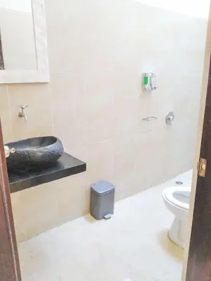 a bathroom with a sink and a toilet at Salt Hideaway - 2 BR apartment, central Seminyak in Seminyak