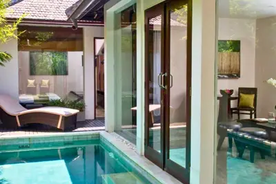 a villa with a swimming pool and a patio at Liam 1 BR Bamboo Private Pool Villa JU63 in Seminyak