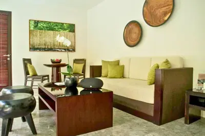 a living room with a couch and a table at Liam 1 BR Bamboo Private Pool Villa JU63 in Seminyak