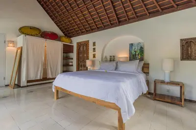 a bedroom with a large bed in a room at Bali Villa Home in Seminyak