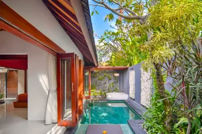 a swimming pool in the middle of a house at Sadawira 1 BR Private Pool Villa & Bathtub ZN168 in Legian