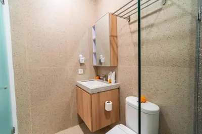 a bathroom with a sink and a toilet and a shower at Alyxia 1 Bedroom Apartment in Central Seminyak in Seminyak