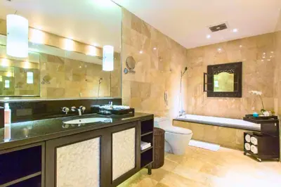 a bathroom with a sink and a toilet and a tub at Dilana 2 BR Bamboo Villas JU66 in Seminyak