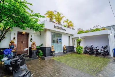 a group of motorcycles parked outside of a building at MIMU C-O Living in Kerobokan