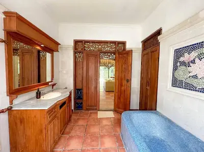 a bathroom with a sink and a bath tub at Villa Pande Sanur Beach Side in Sanur