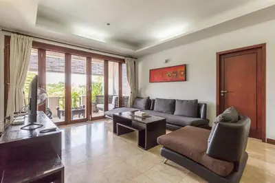 a living room with a couch and a table at Quiet Central Seminyak 2bd 2 bath and walk to eat st in Seminyak