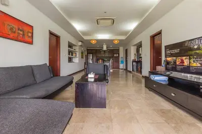 a living room with a couch and a table at Quiet Central Seminyak 2bd 2 bath and walk to eat st in Seminyak