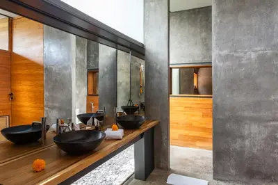 a bathroom with four sinks and a row of mirrors at Luxury Industrial Villa with Sauna and Highend Amenities in Seminyak