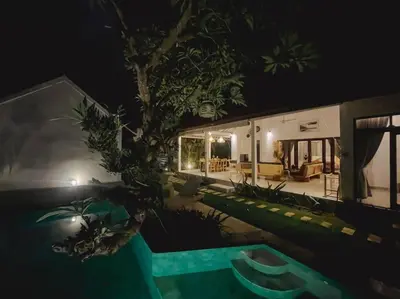 a house with a swimming pool at night at Nawa Villa private pool 3bedrooms in Seminyak