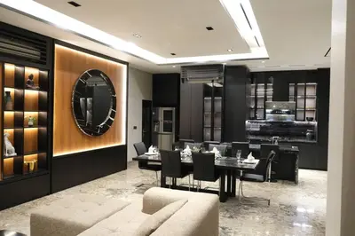 a dining room with a table and a mirror at Modern Palace in Seminyak - Qmoya Villa in Seminyak