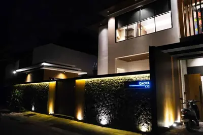 a building with a street sign in front of it at night at Modern Palace in Seminyak - Qmoya Villa in Seminyak