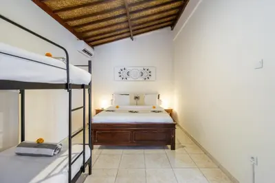 a bedroom with two bunk beds in a room at Villa Simara in Seminyak