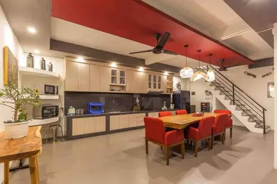 a kitchen and dining room with a table and chairs at Big 3 bed, to BatuBelig Beach, last min specials in Kerobokan
