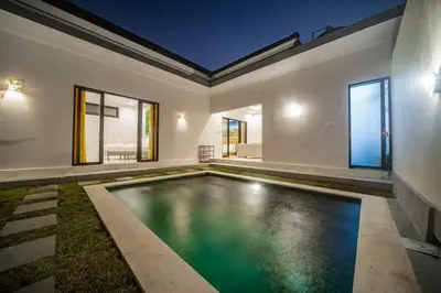 an indoor swimming pool in a house at Villa Semangka, Seminyak Umalas in Kerobokan