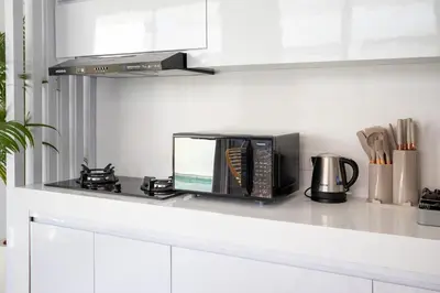 a microwave oven sitting on a counter in a kitchen at Letto 1 - Luxurious Villa with Pool in Canggu in Canggu