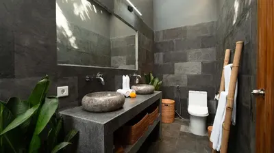a bathroom with a sink and a toilet at Villa Alami by Villa Finder in Seminyak