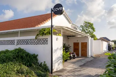 a house with alove sign on the side of it at Cove Lotus Lofts Seminyak in Seminyak