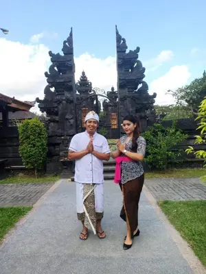 a man and a woman standing in front of a temple at 7to8BR 40 off special Brilliant Location in Seminyak