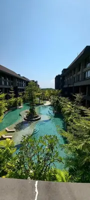 a body of water next to some buildings at de' Asasta Apartment Benoa N508 in Nusa Dua