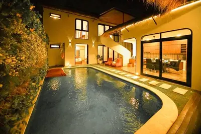 a large swimming pool in a house at Villa Raaadha 3BR modern design villa center of seminyak in Seminyak