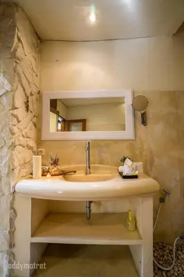 a bathroom with a sink and a mirror at Tropical 3BR villa in the heart of Seminyak in Seminyak