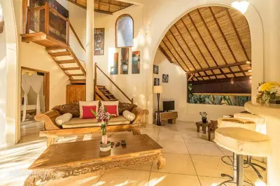 a living room with a couch and a table at Tropical 3BR villa in the heart of Seminyak in Seminyak