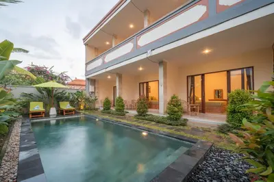 an image of a villa with a swimming pool at Titeng Guest House - Comfortable studio in amazing location near Potato Head and the beach in Seminyak