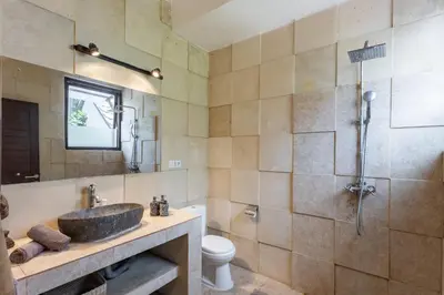 a bathroom with a sink and a shower at 3 BR Villa in d' centre Seminyak in Seminyak