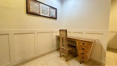a room with a desk and a picture on the wall at Taman Giri House 3 Bedrooms Nusa Dua in Nusa Dua