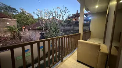 a balcony with a view of a house at Taman Giri House 3 Bedrooms Nusa Dua in Nusa Dua