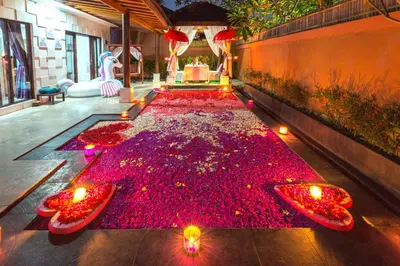 a room with a carpet of red flowers on the floor at Lavender Private Villa Kuta Bali in Kuta