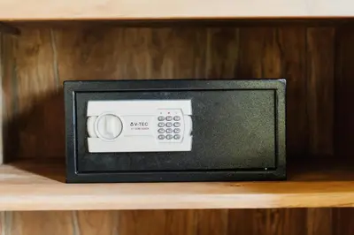 a microwave sitting on top of a wooden shelf at You Suite Seminyak in Legian