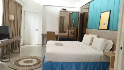 a hotel room with a bed and a television at 2 BR Bougenville Villa in Nusa Dua