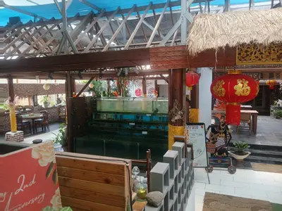 a restaurant with a bar in a building at Villa Pool Private and Romantic In Kuta Bali in Kuta