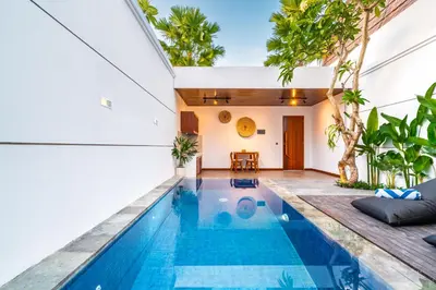 an indoor pool in a house with a villa at Villa Felicia Canggu By Moria in Canggu