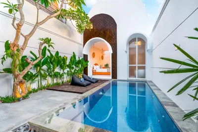 an indoor pool in a house with a villa at Villa Felicia Canggu By Moria in Canggu
