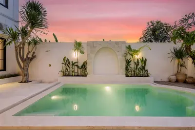 a swimming pool in the backyard of a house at Casa De La Vida in Legian