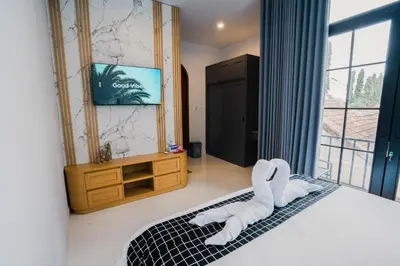 a bedroom with a bed with white towels on it at Sari Buana Villa Nusa Dua in Nusa Dua
