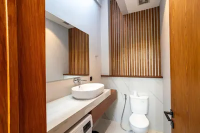 a bathroom with a sink and a toilet at Luxury Haven Stunning 2Br in Umalas Canggu in Kerobokan