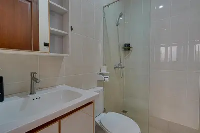 a bathroom with a toilet and a sink and a shower at Villa Taman Seminyak 46 Near Double Six Beach in Seminyak