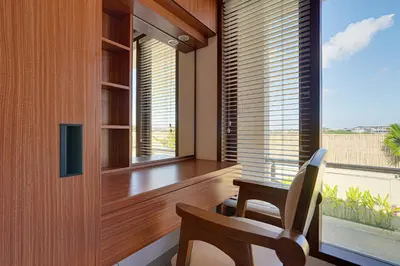 a room with a table and a chair and a window at Villa Taman Seminyak 46 Near Double Six Beach in Seminyak