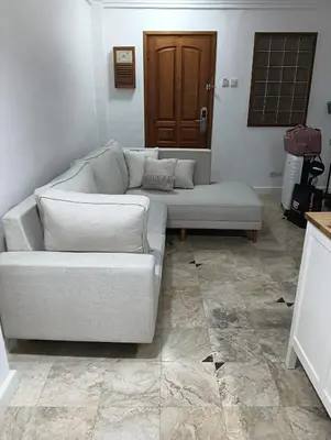 a couch sitting in a living room with at Jayakarta Bali Apartment 6417 in Seminyak