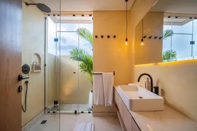 a bathroom with a sink and a shower at Villa Casa Del Sol Umalas in Kerobokan