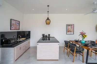 a kitchen and dining room with a table and chairs at Kubung 2 - Perfect Retreat in Canggu in Kerobokan