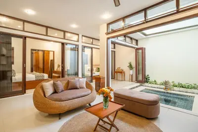 a living room with a couch and a table at Seven Residence in Seminyak