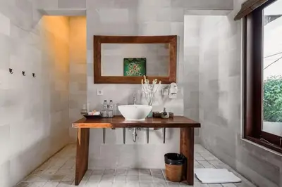 a bathroom with a sink and a mirror at Villa Annecy in Seminyak