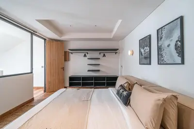 a living room with a couch and a window at Villa Moana - Incredible 2BR Villa Next To The Beach in Canggu in Canggu