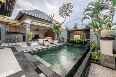 a swimming pool in the backyard of a house at QLO Villa , Seminyak in Seminyak
