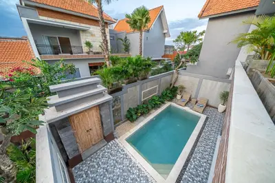 an aerial view of a house with a swimming pool at Q LA Villas in Seminyak