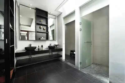 a bathroom with two sinks and a mirror at The Black Pearl - The Best 1br Villa In Seminyak in Seminyak